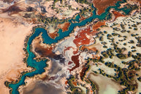 Blue Dragon – aerial photograph by Steven Manolakis, showing a winding blue tidal channel resembling the form of a dragon in Western Australia