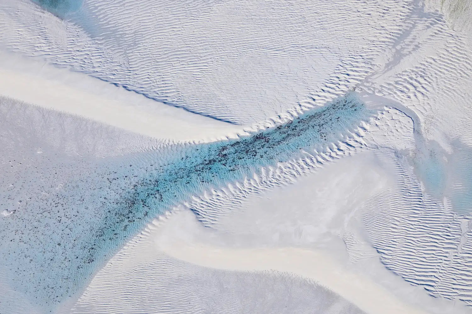 Still aerial art, Lacepede Islands, Western Australia. White sand and deep turquoise water channel.